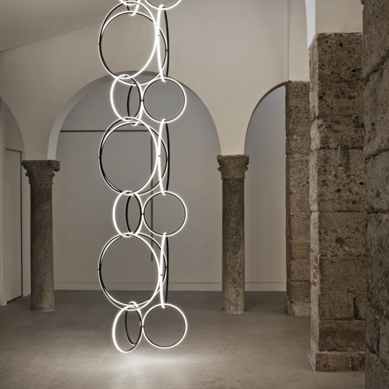 Circular FLOS Arrangements light fixtures interlock with each other to form a unique hanging installation