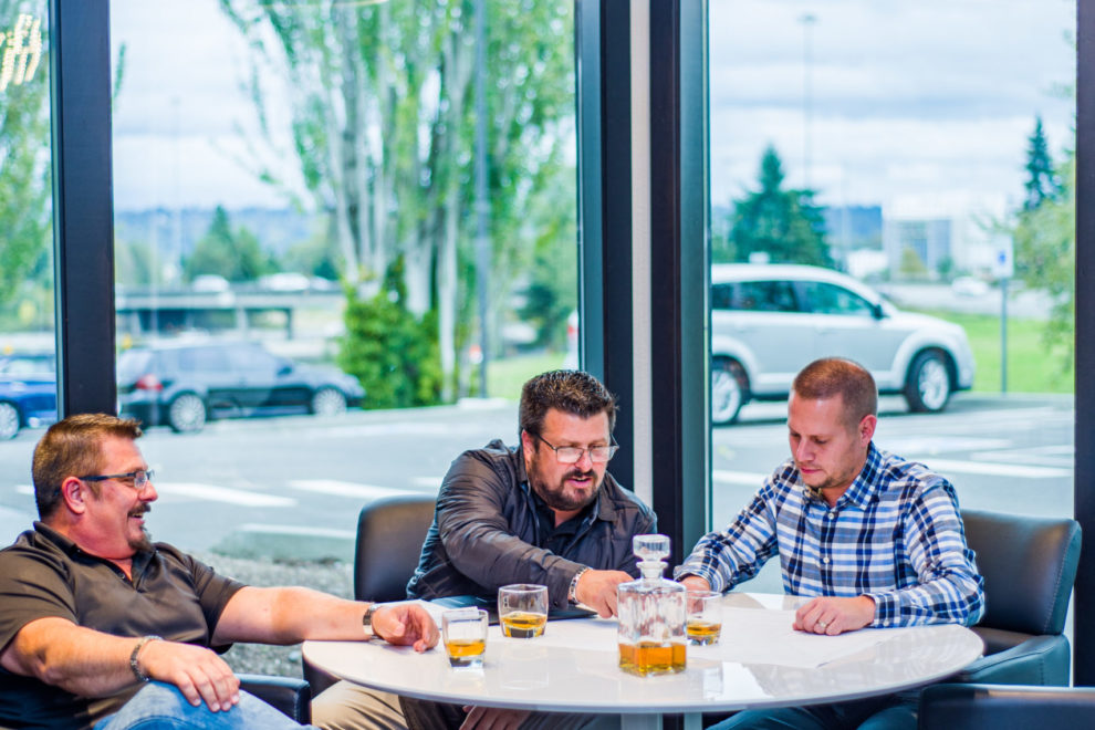 Sea-Tac lighting team members meet with a client to close a deal