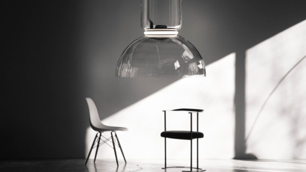 FLOS Decorative Noctambule Suspension lighting over a pair of chairs