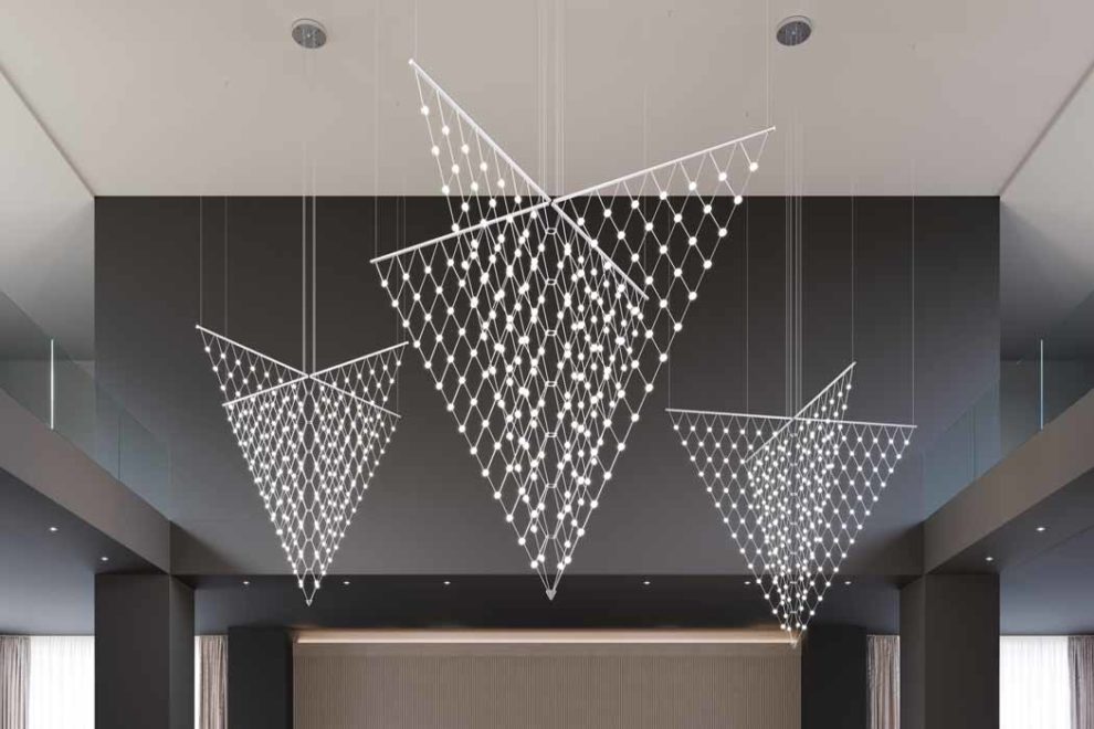 Sonneman Arrow chandelier hanging in a foyer
